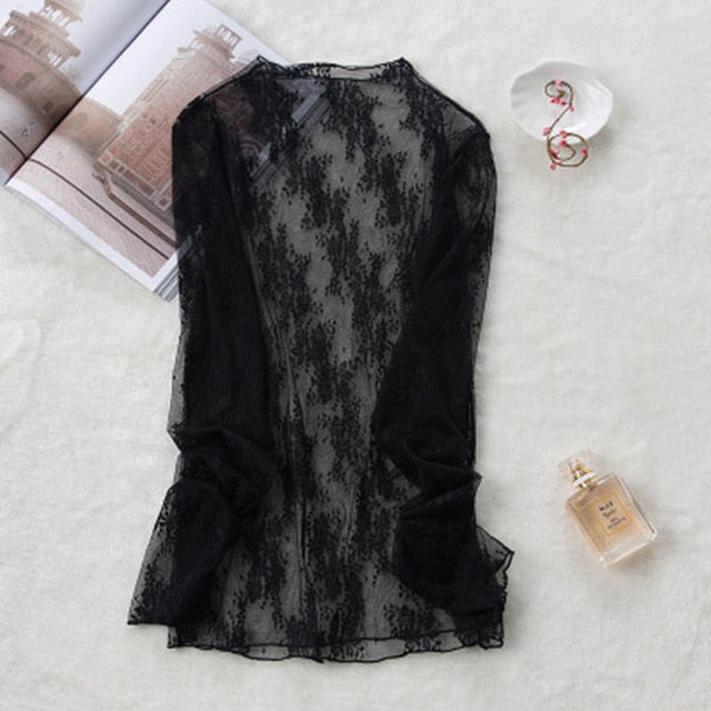 Blusa de encaje semitransparente de corte holgado