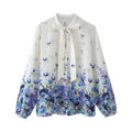 Blusa estampada elegante con lazo
