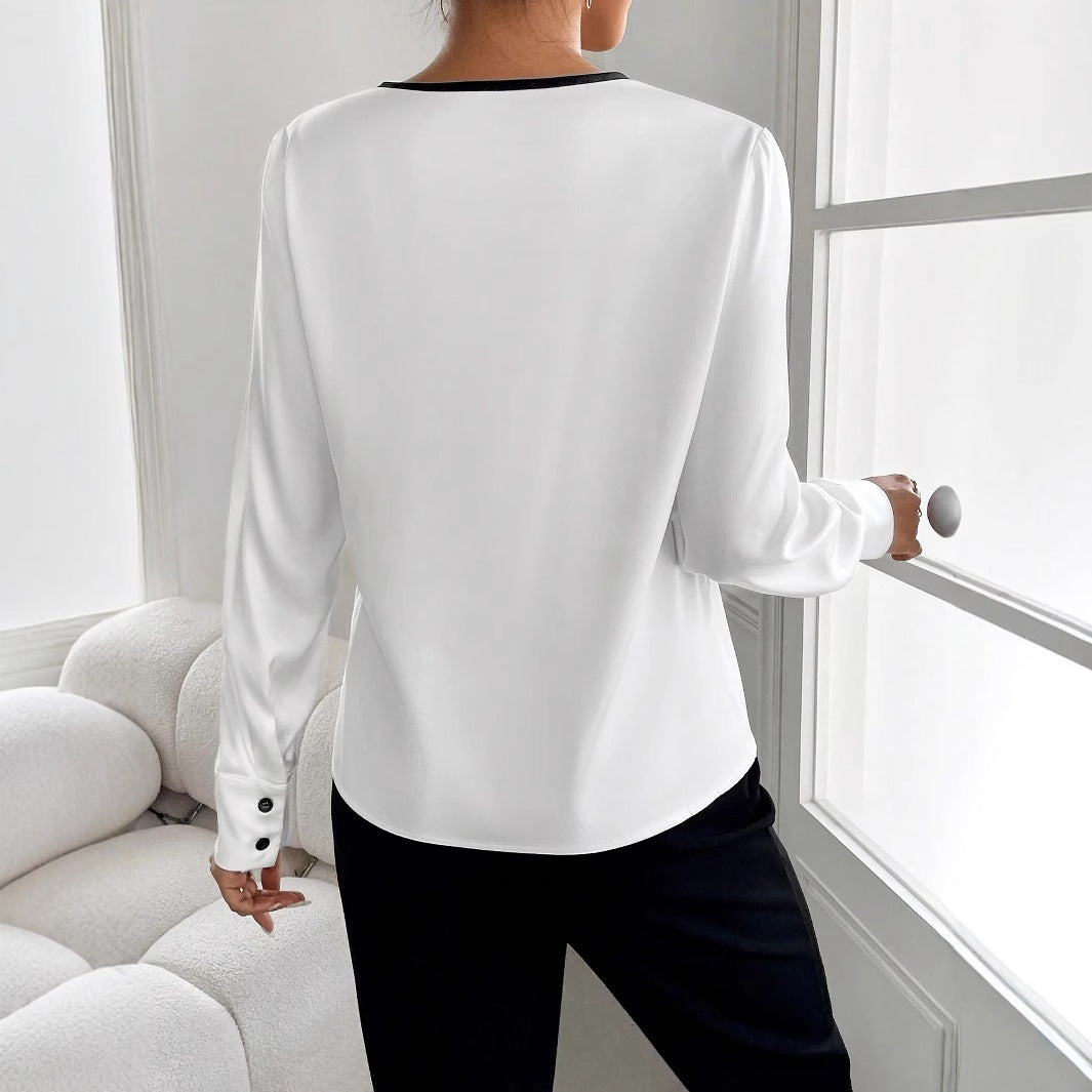 Blusa bicolor de manga larga con cuello redondo