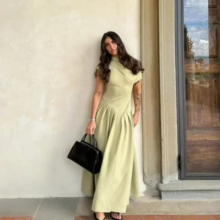 Vestido largo evasé de cintura alta con abertura