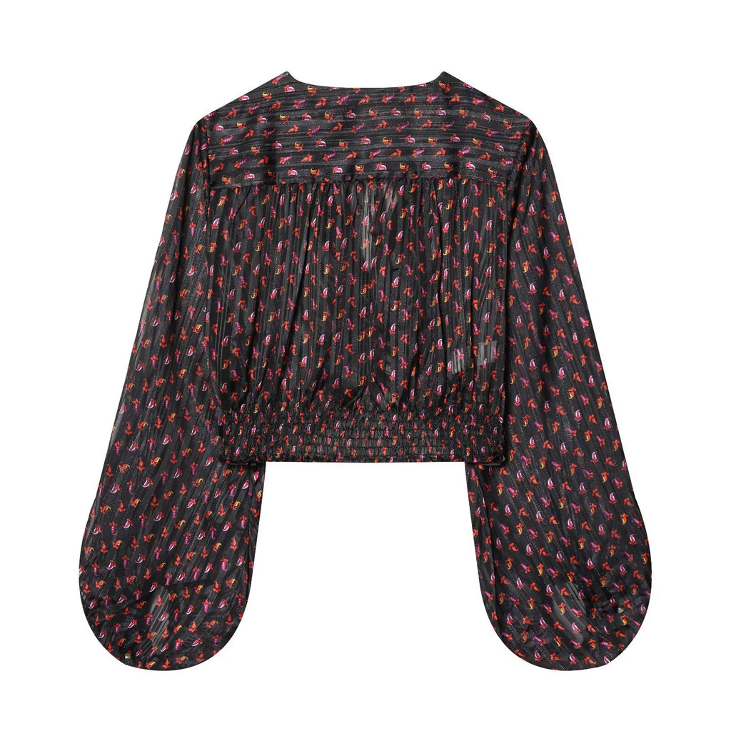 Top estampado de manga larga con escote en V y lazada