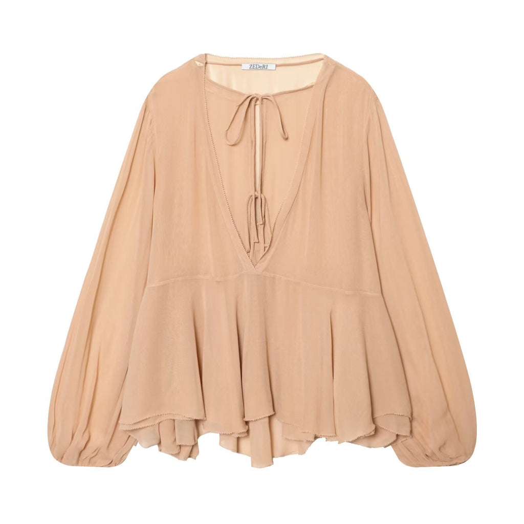 Blusa holgada de manga larga con cuello de volantes