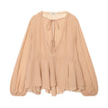 Blusa holgada de manga larga con cuello de volantes