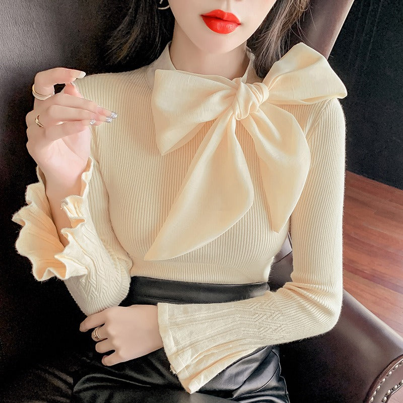 Jersey elegante con gran lazo y manga acampanada