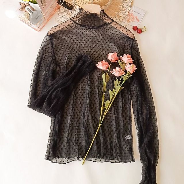 Blusa de encaje semitransparente de corte holgado