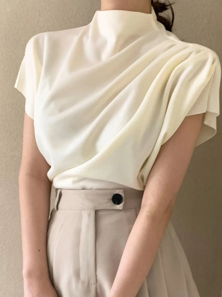 Blusa holgada de manga corta con cuello semialto