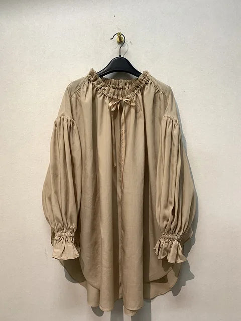 Blusa vintage con escote en V y lazada