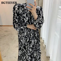 Vestido midi estampado de manga larga con cuello alto y lazada