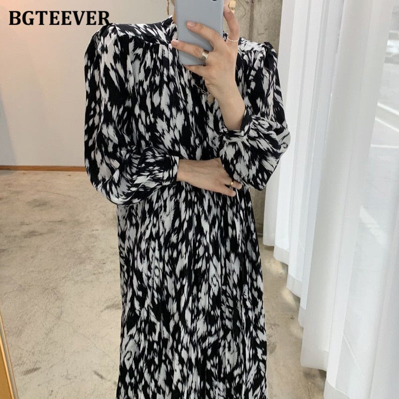 Vestido midi estampado de manga larga con cuello alto y lazada