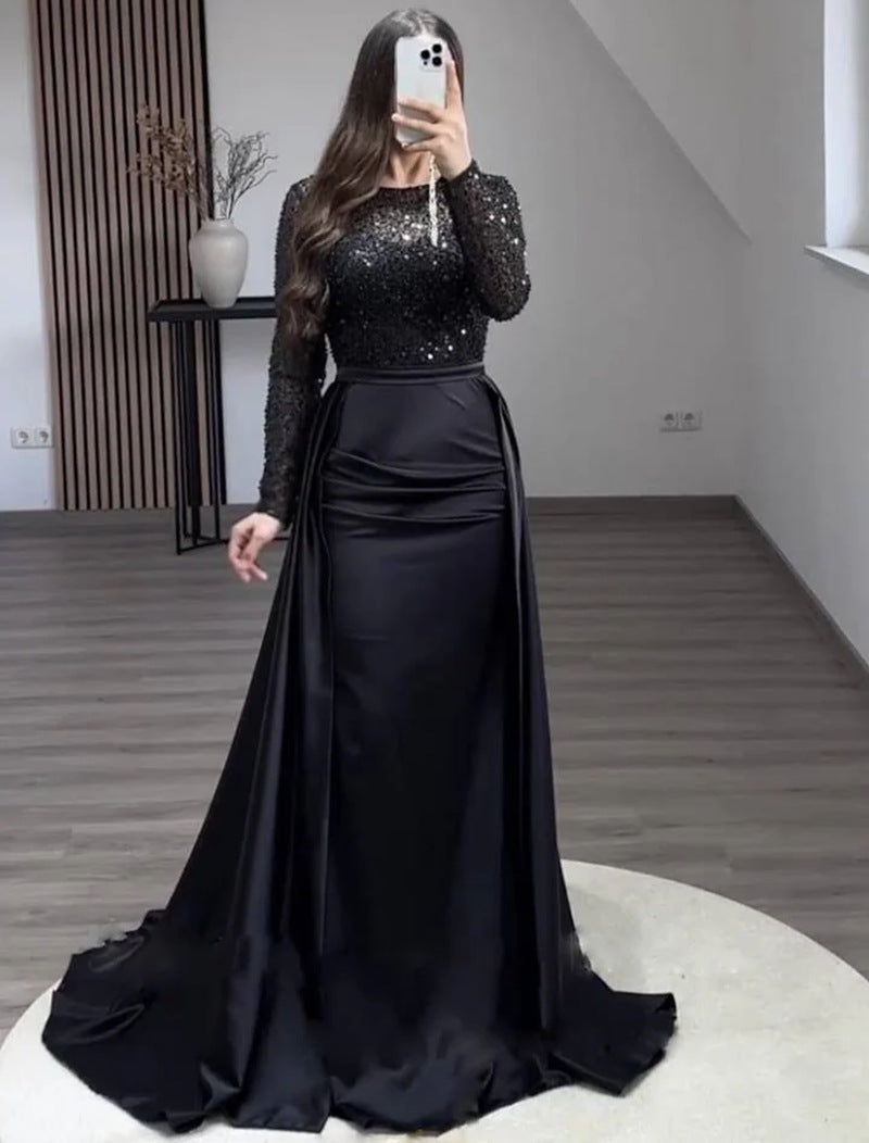 Vestido largo de noche con cuerpo de lentejuelas y falda satinada
