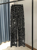 Pantalón brillante de cintura alta y pierna ancha
