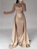 Vestido largo de noche con cuerpo de lentejuelas y falda satinada