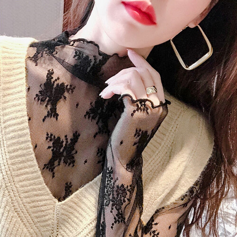 Blusa de encaje semitransparente de corte holgado