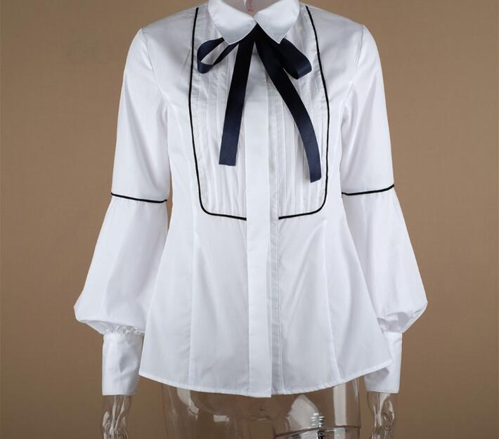 Blusa blanca de oficina con lazo y manga farol