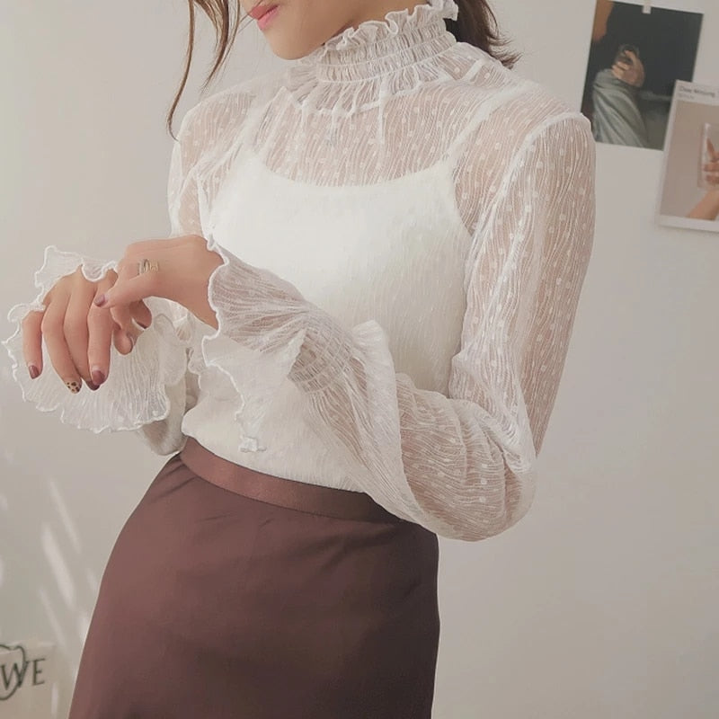 Blusa de encaje semitransparente de corte holgado