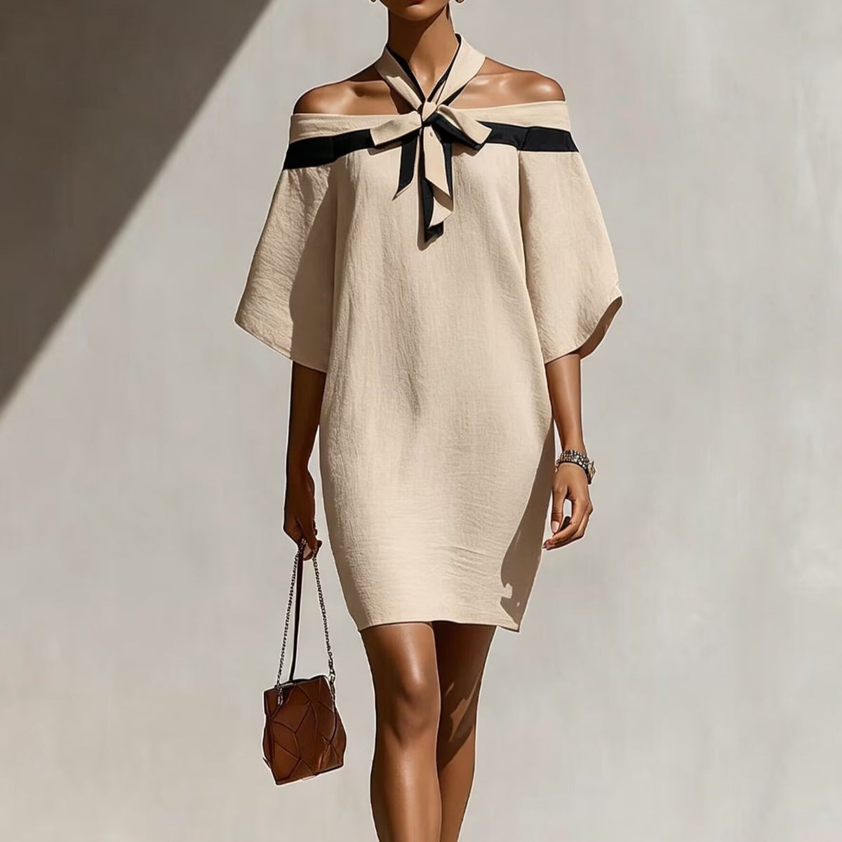 Vestido asimétrico con lazo en el escote