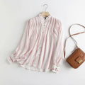 Blusa roja de rayas con volantes y manga larga
