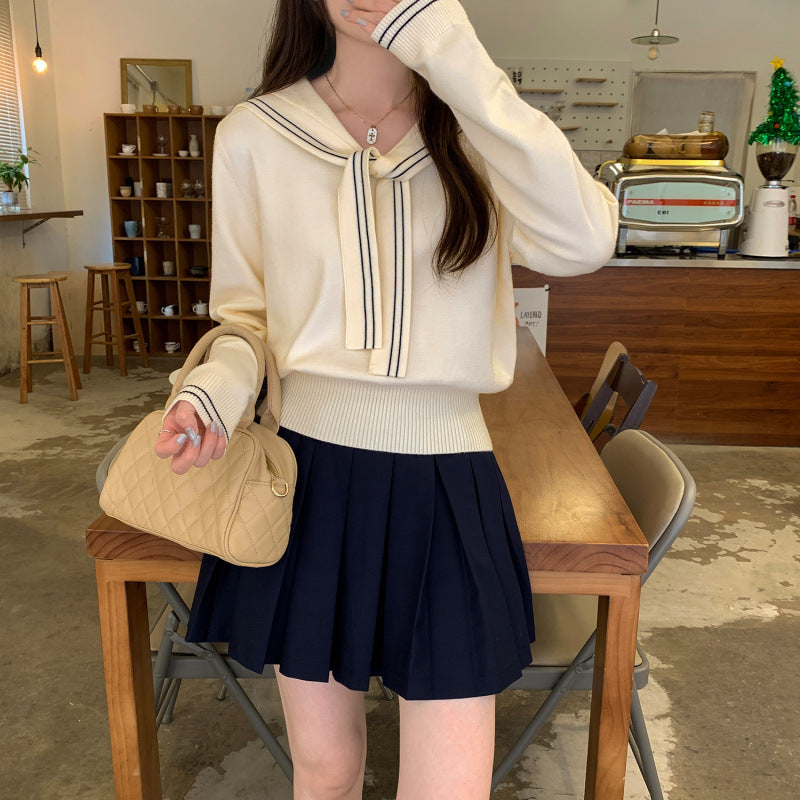 Jersey largo de punto con cuello marinero y lazada