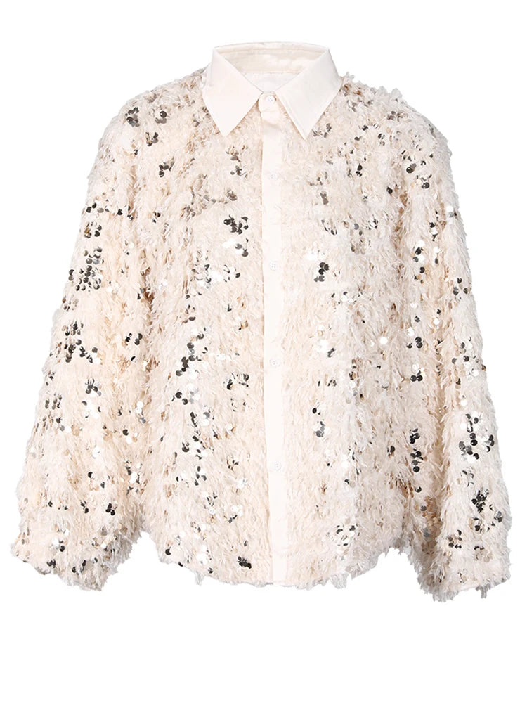 Blusa holgada con lentejuelas y manga larga