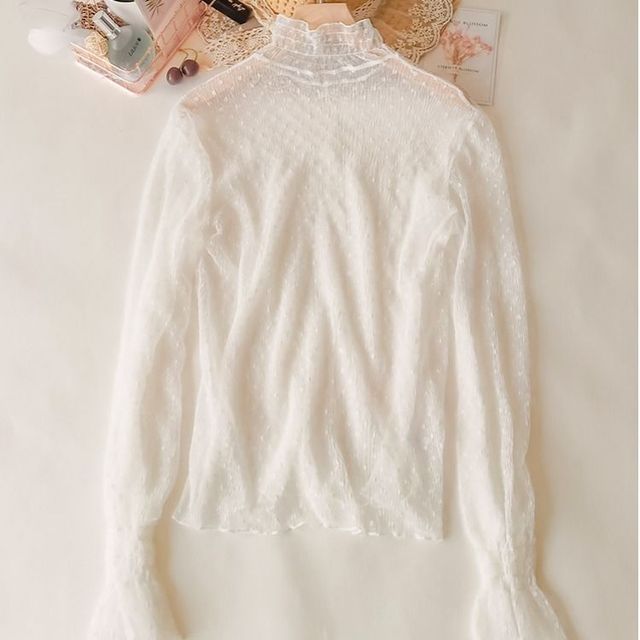 Blusa de encaje semitransparente de corte holgado