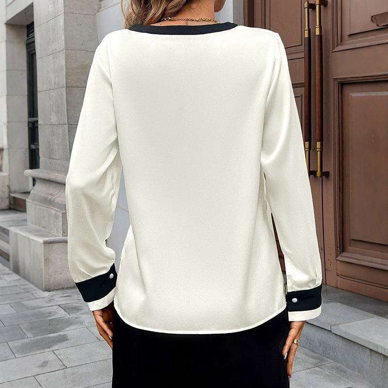 Camisa elegante con botones de perla y escote en V