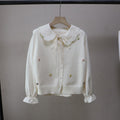 Conjunto de camisa y chaleco de punto