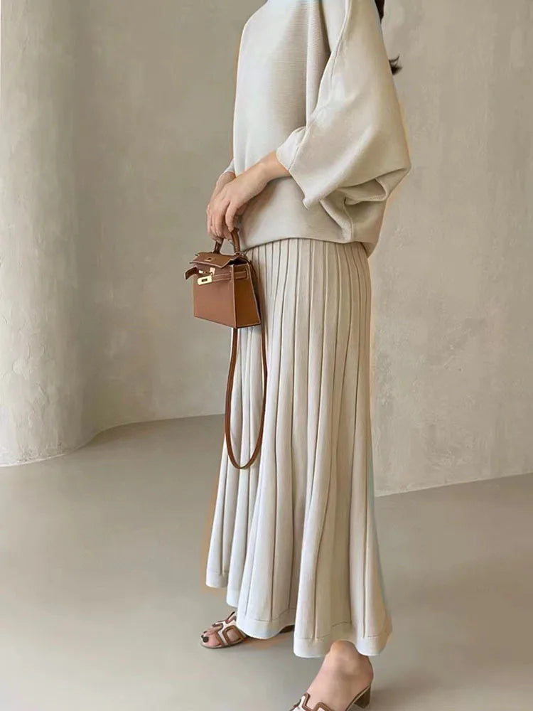 Conjunto de punto de jersey y falda plisada