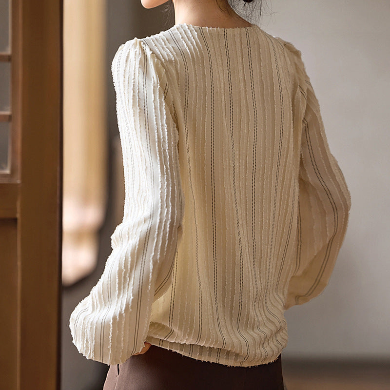 Blusa elegante de cuello texturizado