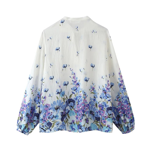 Blusa estampada elegante con lazo