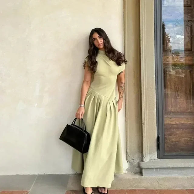Vestido largo evasé de cintura alta con abertura
