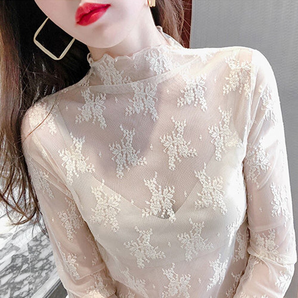 Blusa de encaje semitransparente de corte holgado