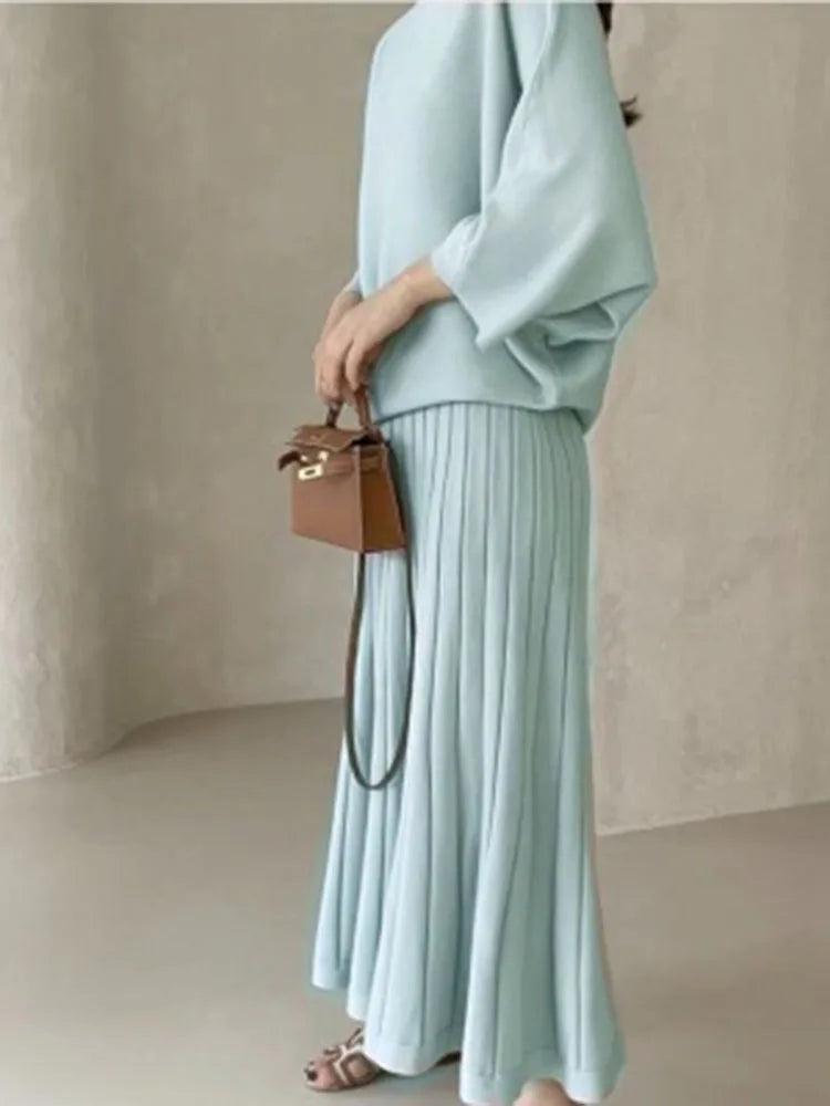 Conjunto de punto de jersey y falda plisada
