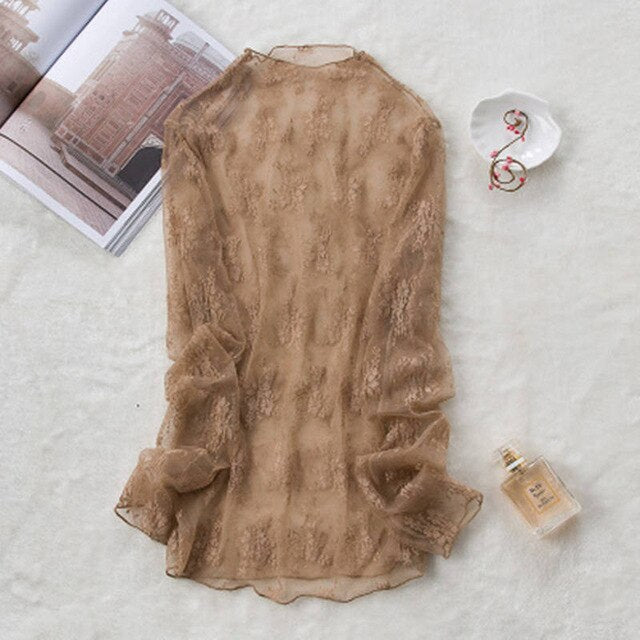 Blusa de encaje semitransparente de corte holgado