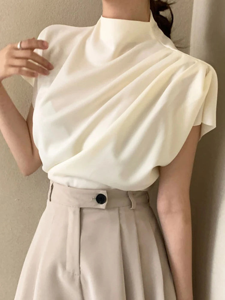 Blusa holgada de manga corta con cuello semialto