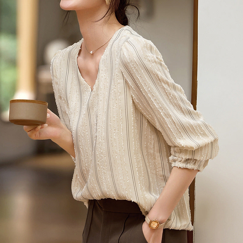 Blusa elegante de cuello texturizado