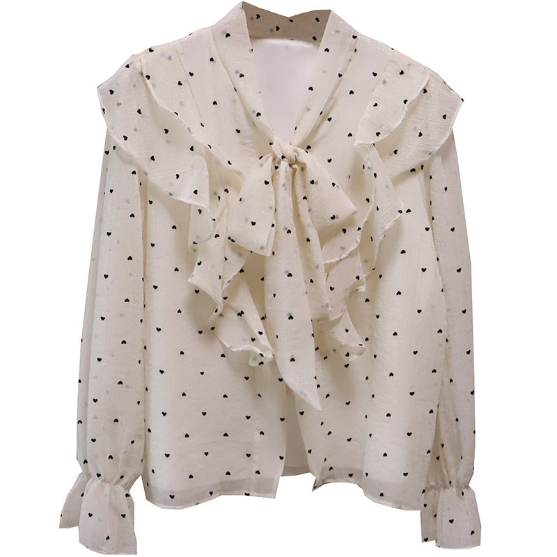 Blusa romántica con volantes, botones de perla y lazada