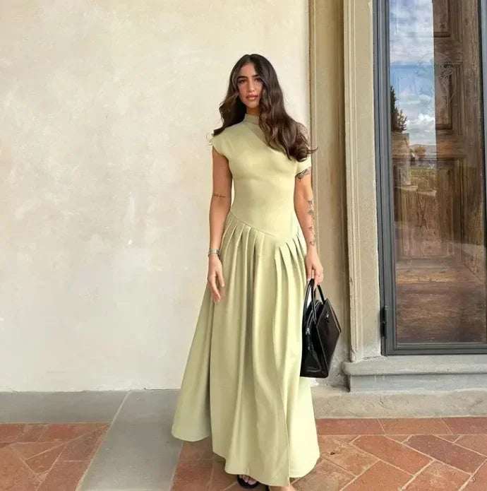 Vestido largo evasé de cintura alta con abertura