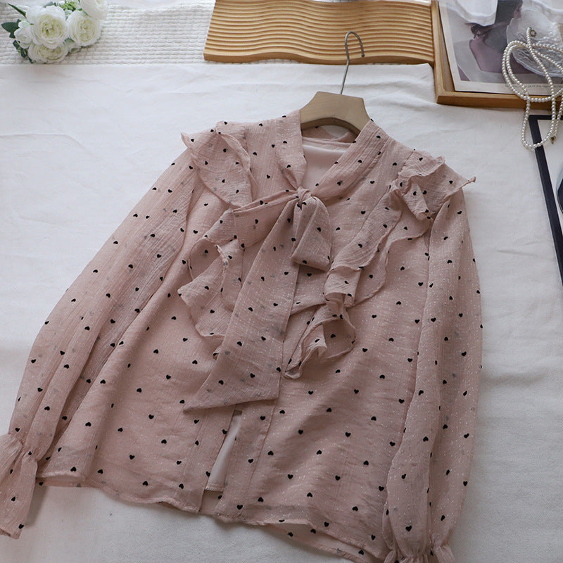 Blusa romántica con volantes, botones de perla y lazada