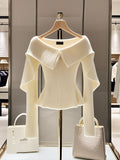 Jersey blanco de punto con cuello polo