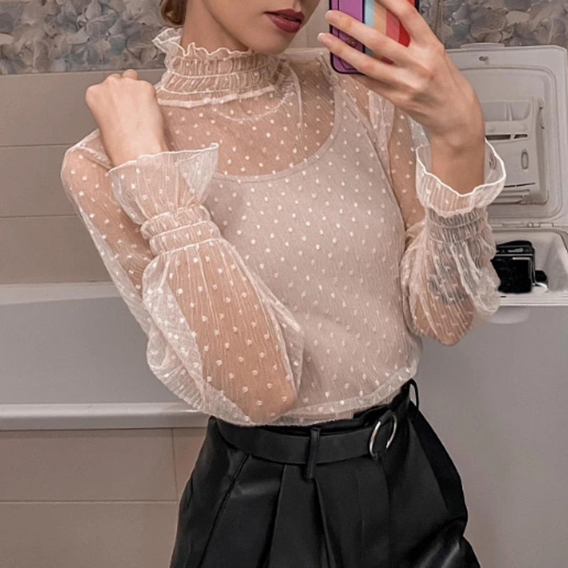 Blusa de encaje semitransparente de corte holgado