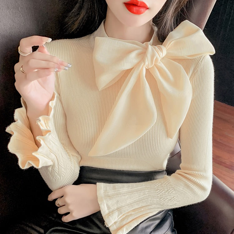 Jersey elegante con gran lazo y manga acampanada