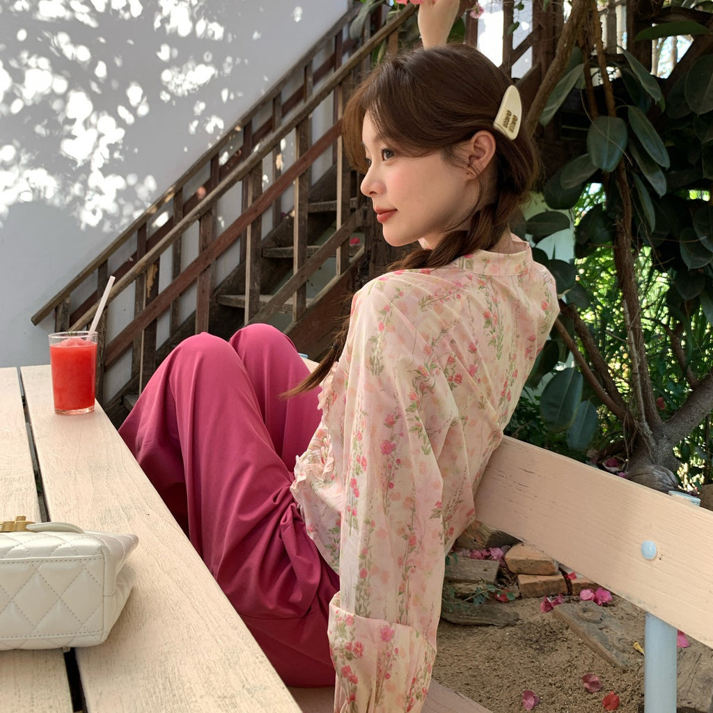 Blusa floral rosa de manga larga con escote en V