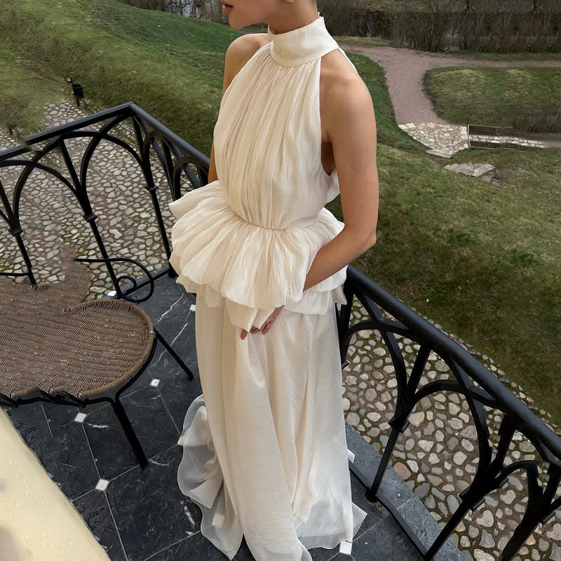 Vestido largo de ceremonia con cuello alto y volantes