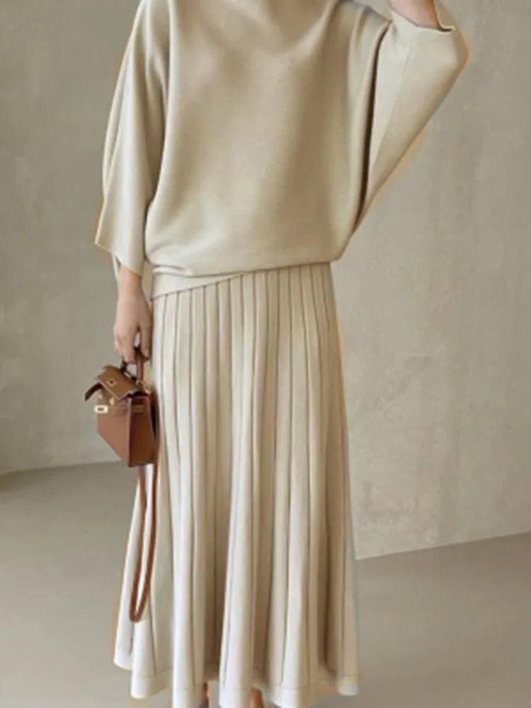 Conjunto de punto de jersey y falda plisada